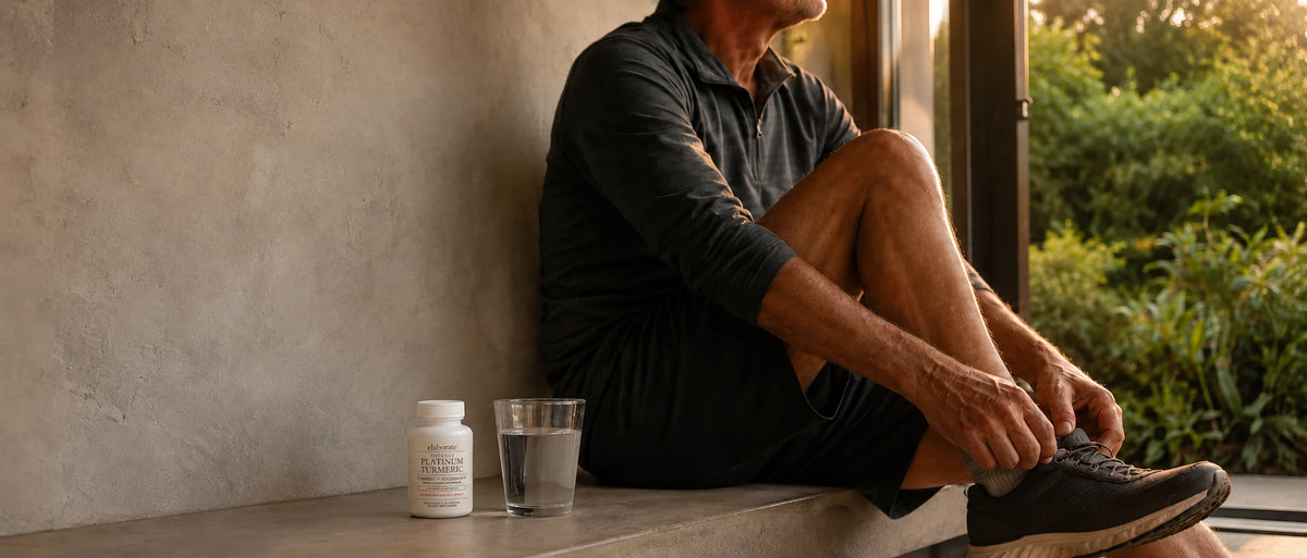 Man tying running shoes with Elaborate Move Platinum Turmeric nearby